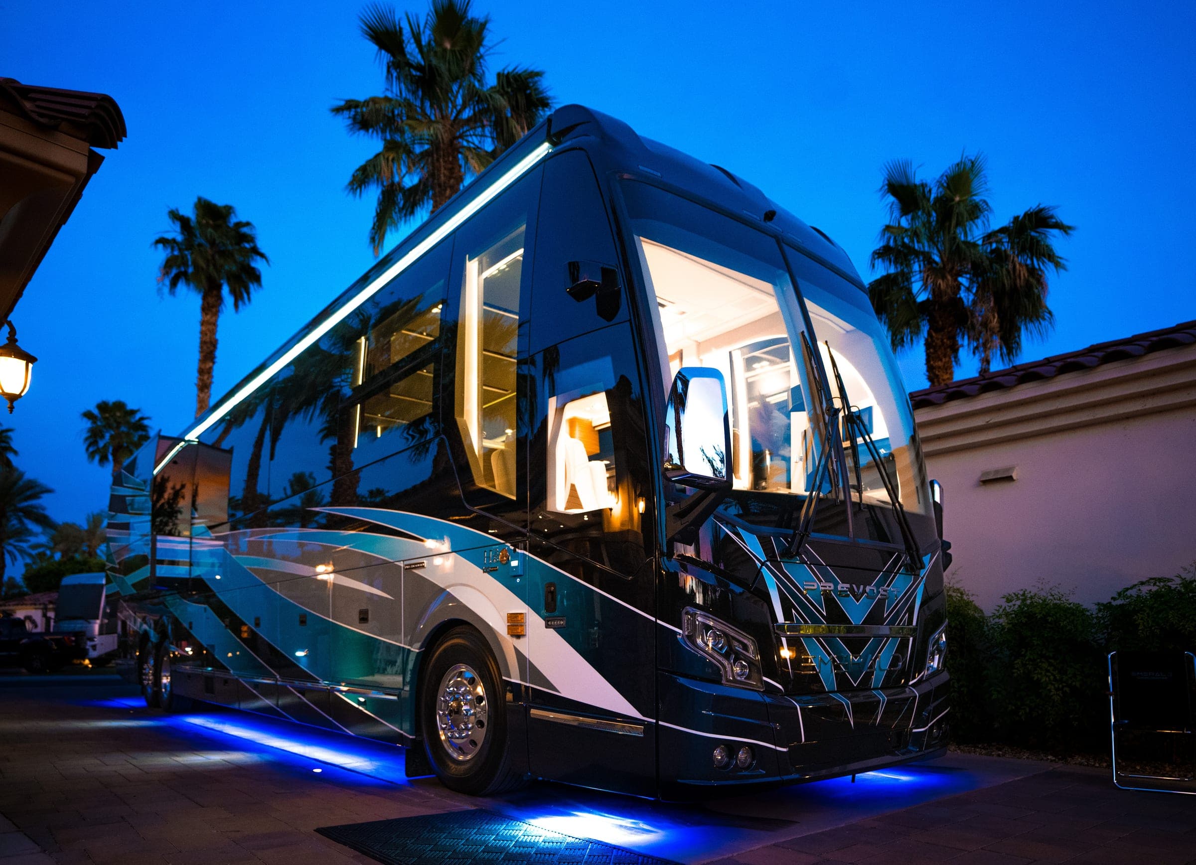 Emerald Prevost with blue and silver custom paint illuminated at dusk